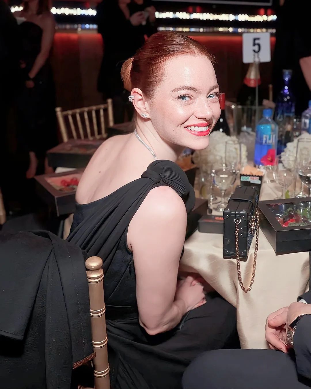 Emma Stone stuns in one-shoulder black Louis Vuitton dress at the ...